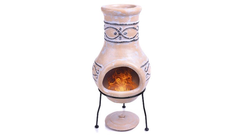 Tan clay chiminea with stand