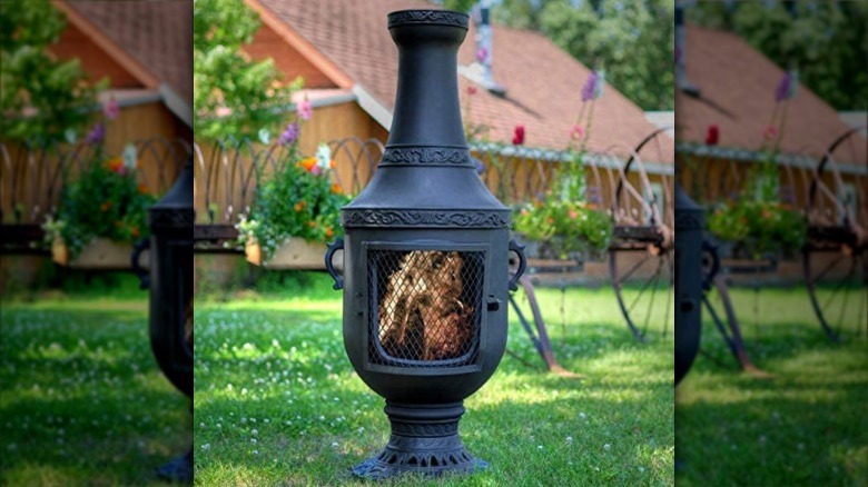 Black chiminea with intricate details