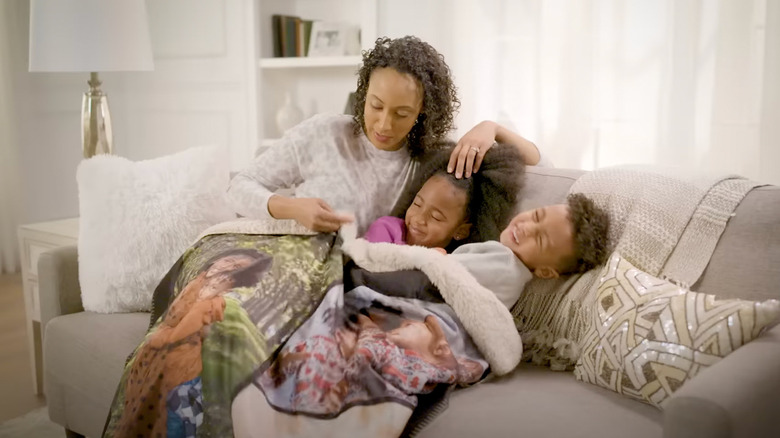 family with photo blanket