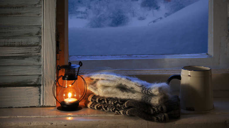 a lantern by a window