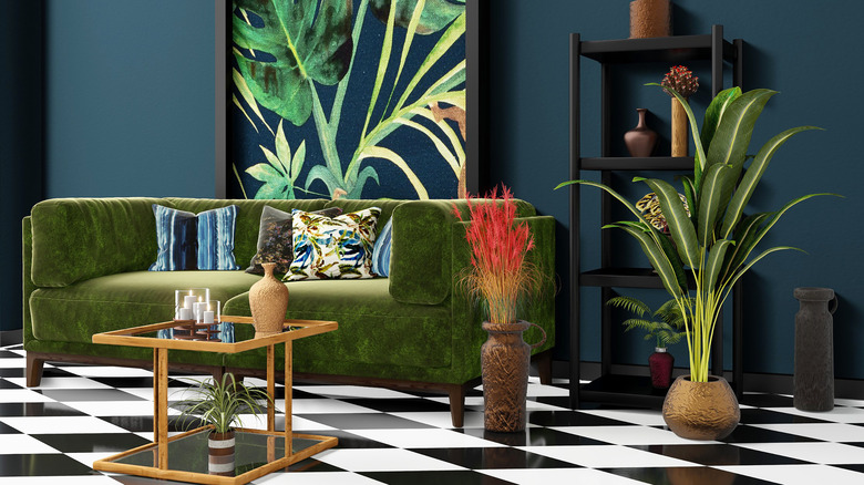 Dark green couch tropical room