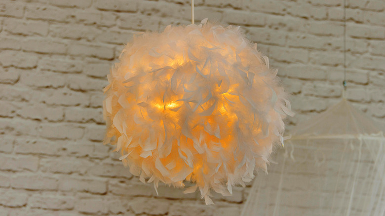 feather covered lamp lit up