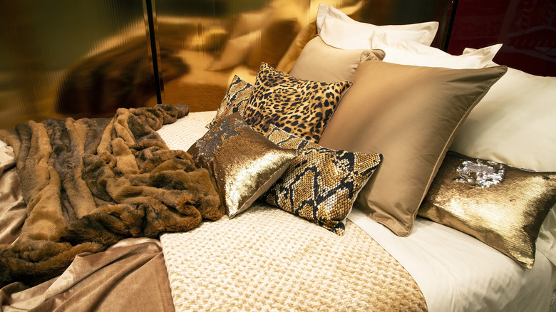animal print pillows on a bed