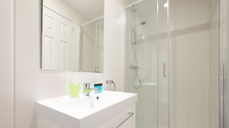 frameless mirror above bathroom sink