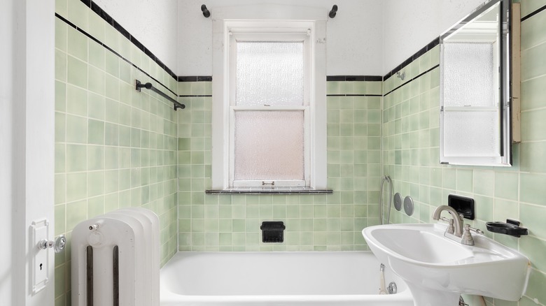 bathroom with green pastel tiles