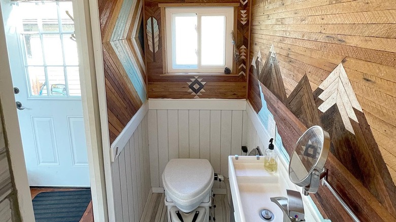 Tiny bathroom with wood feature