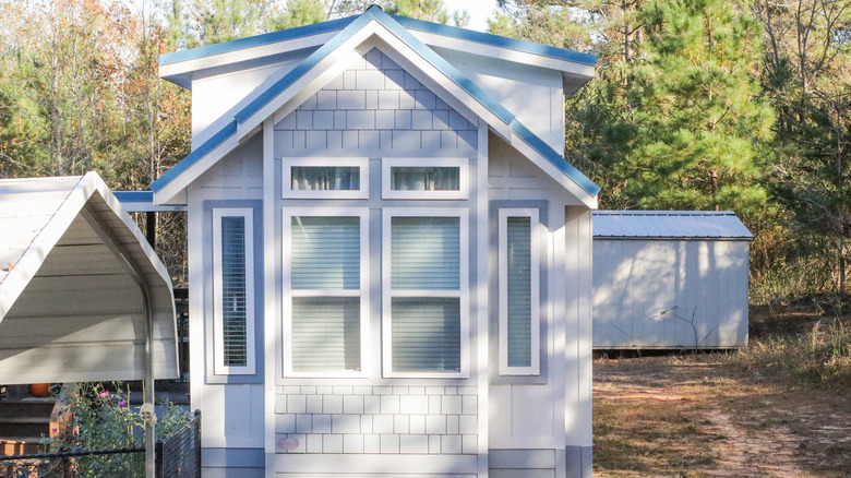 tiny home with carport and shet