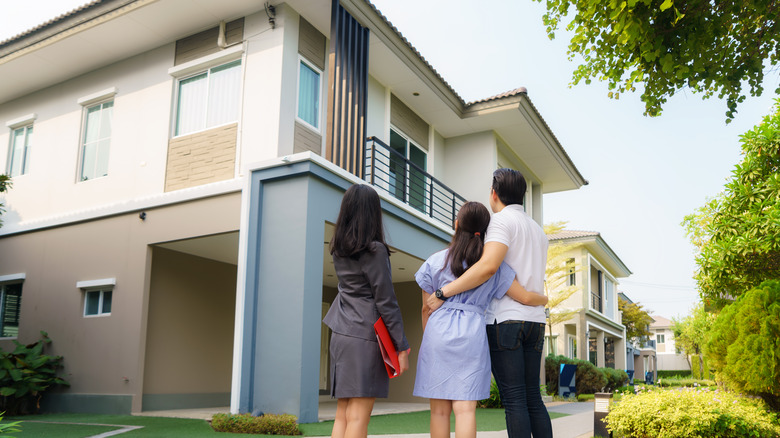 people looking at a house