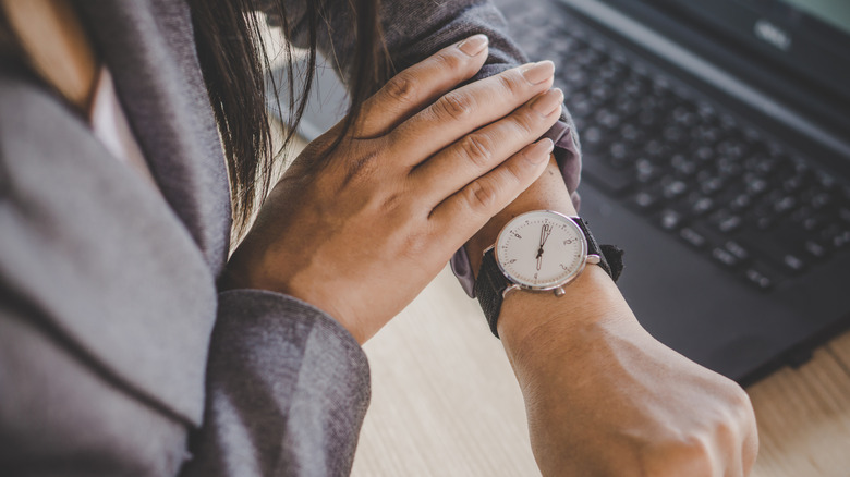 person looking at a watch