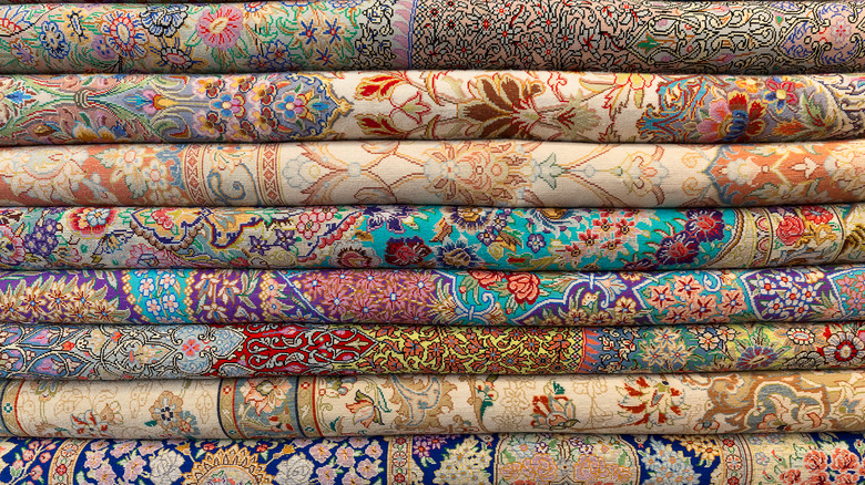 stack of patterned rugs