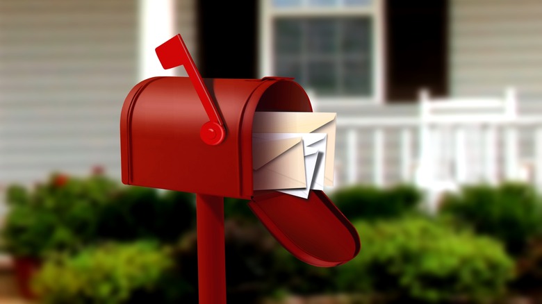 Red mailbox with mail