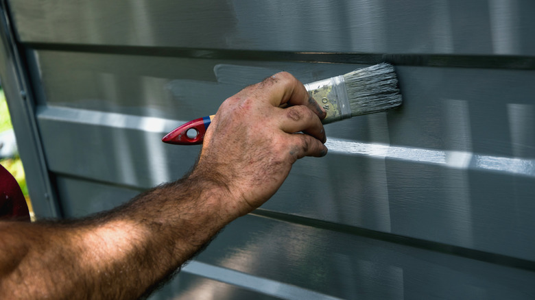 Person painting garage door