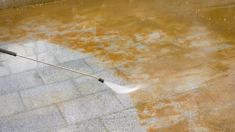 Power washer on concrete bricks