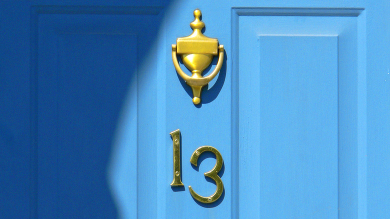 Blue front door with numbers