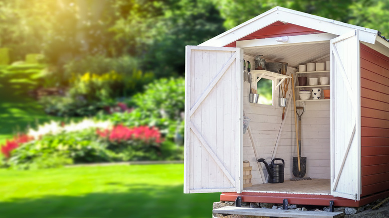 Storage shed filled with gardening tools