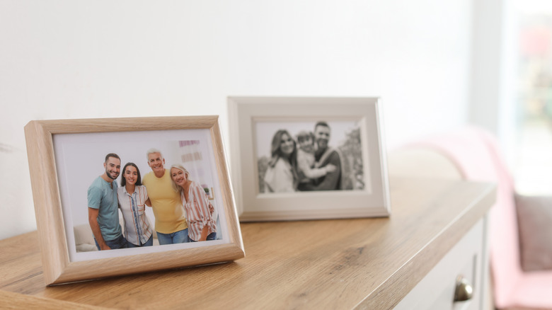 framed family photos on dresser