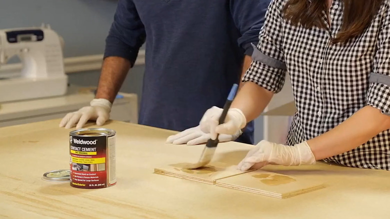 Applying contact cement to laminate pieces