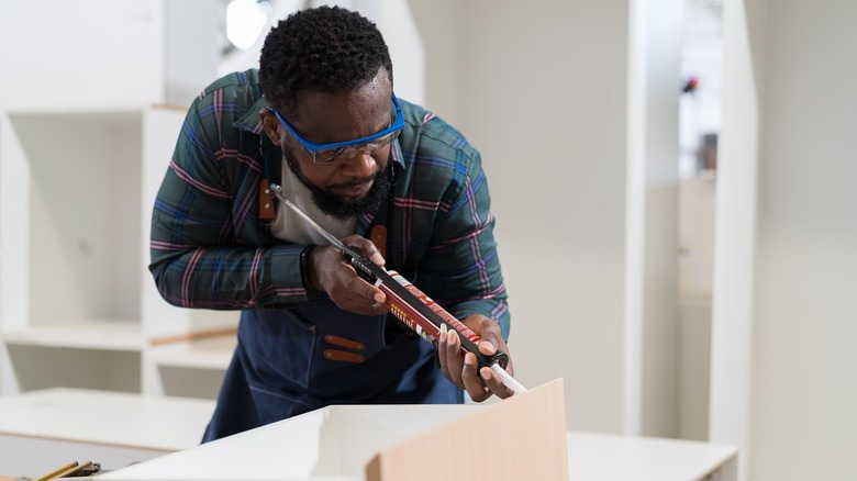 Person using wood glue