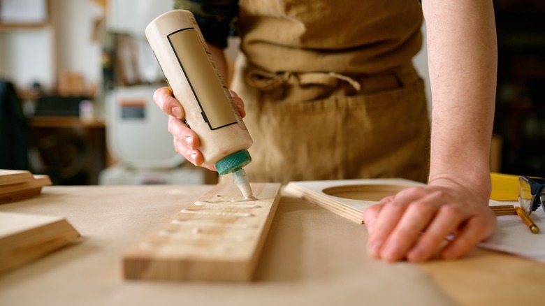 Using glue on wooden board