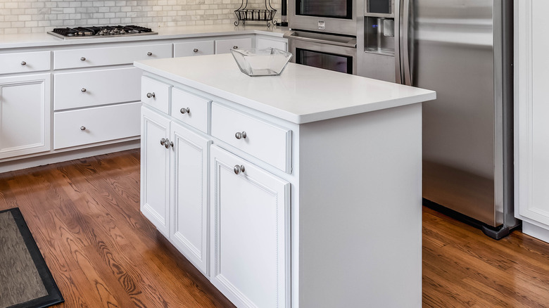 White kitchen island with cabinets