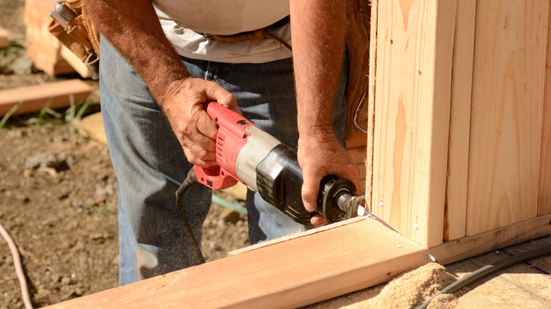 contractor using reciprocating saw