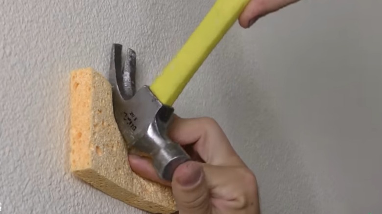 sponge between wall and hammer