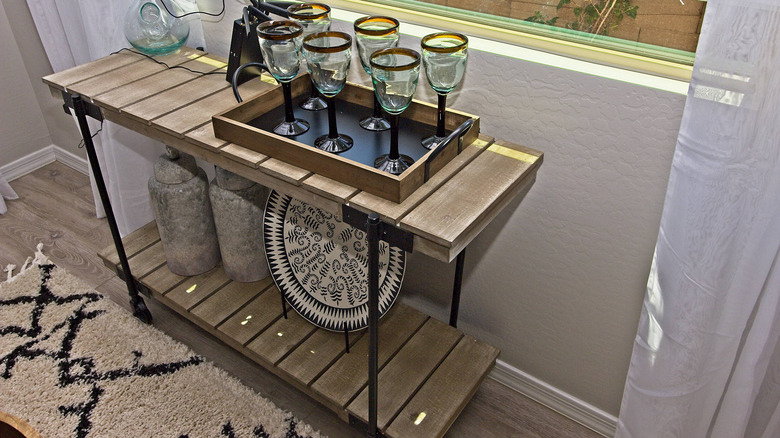 narrow wooden bar cart