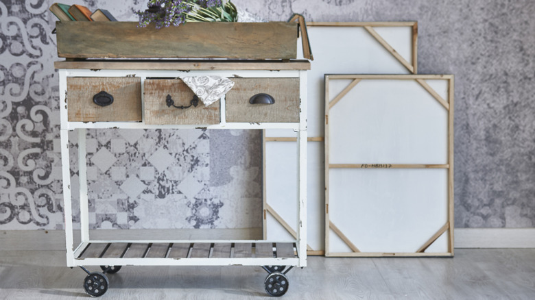 distressed white and wood cart