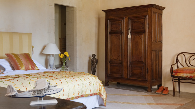 A large armoire inside a bedroom