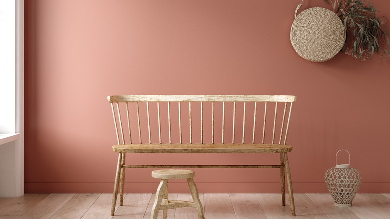 Muted coral wall with bench