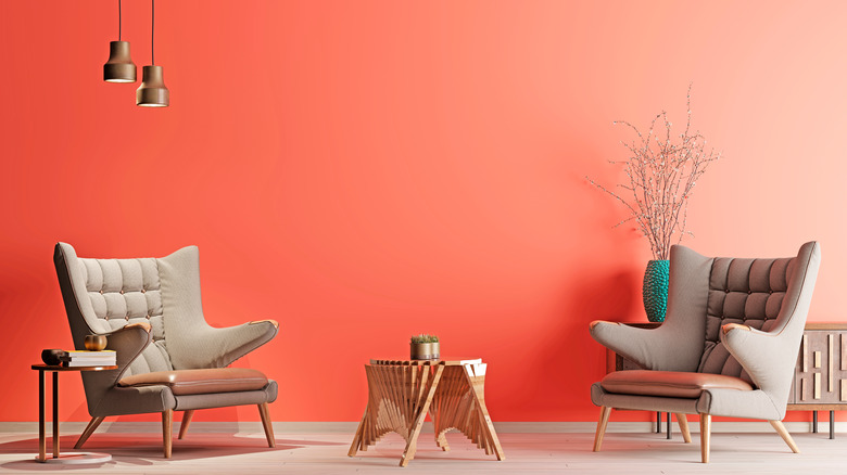 Red coral wall with chairs