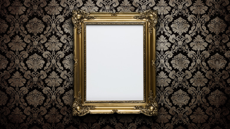 Vintage wallpaper with gilded frame