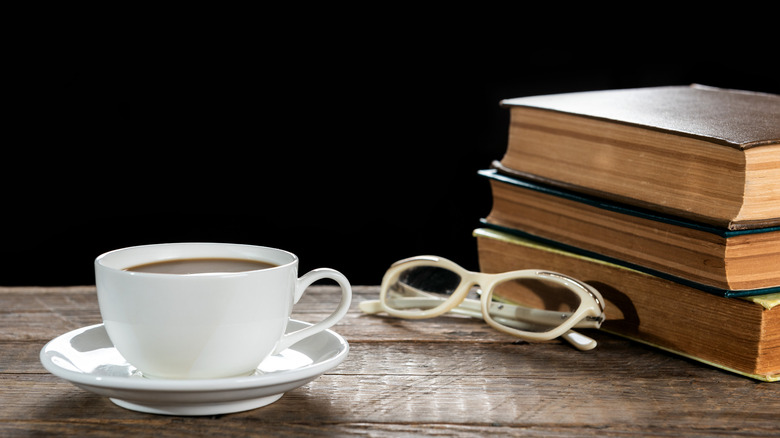 Old books, coffee, and glasses