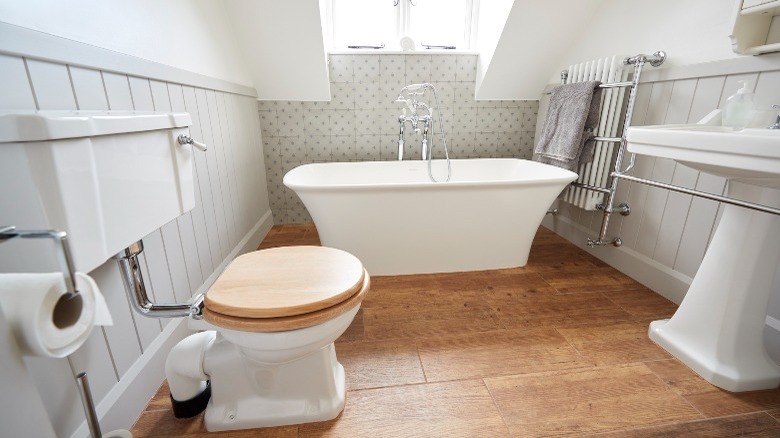 Craftsman bathroom with gray wainscoting