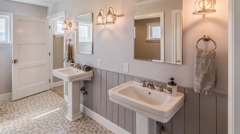 Craftsman bathroom with pedestal sinks