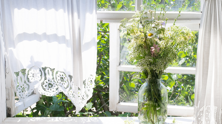 Open window with flower vase