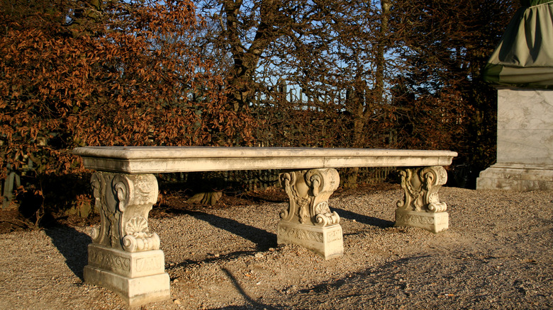 Ornate stone garden bench 