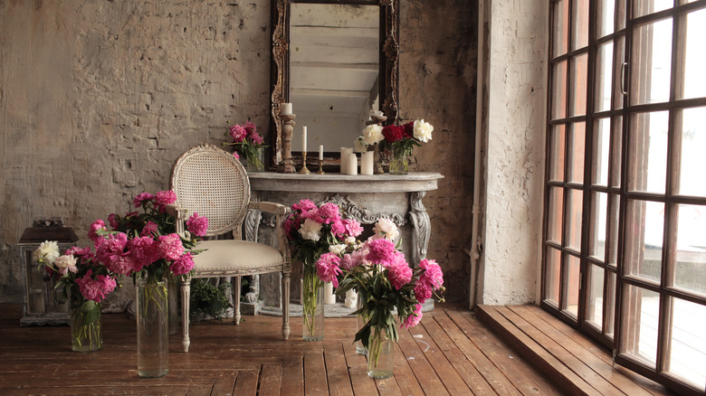 pink flowers and rustic wall