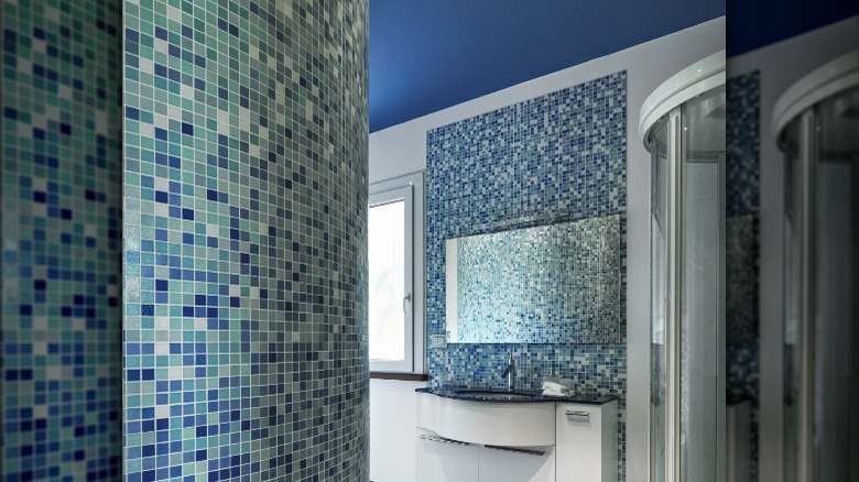 blue ceiling in tiled bathroom