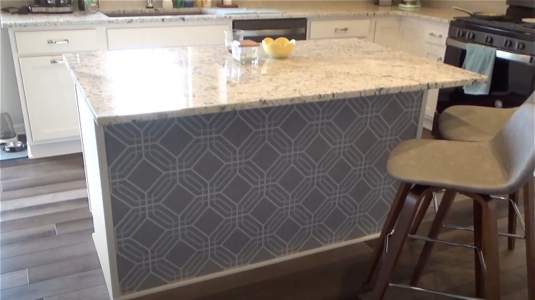 gray wallpaper underneath kitchen island