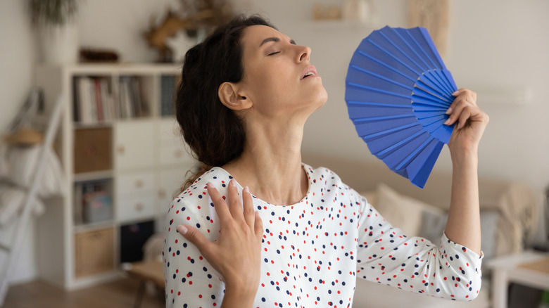 woman fanning herself