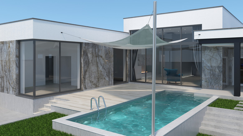 modern home with gray shade sail