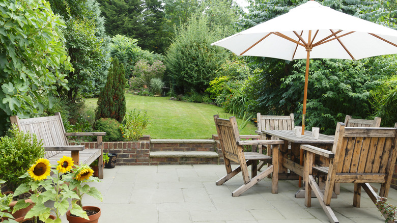 wooden patio furniture with white umbrella