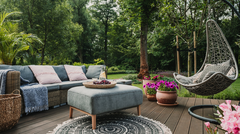 patio with furniture and  flowers