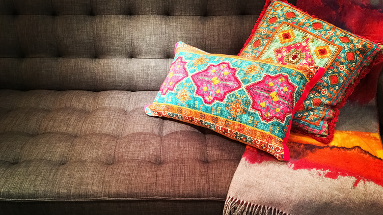 bright patterned cushions on sofa