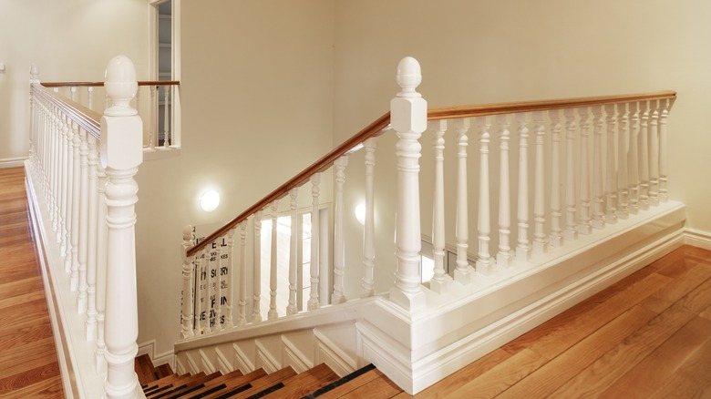 white painted balusters on staircase