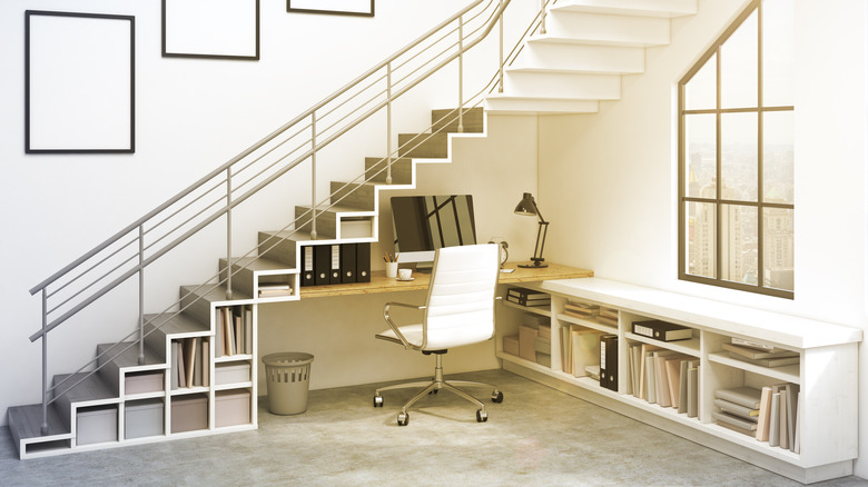 shelves and desk under stairs