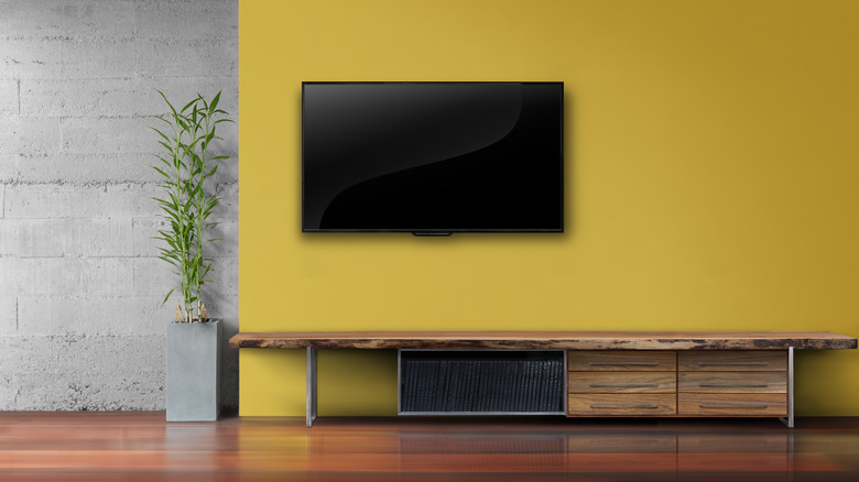 ashy yellow wall with TV