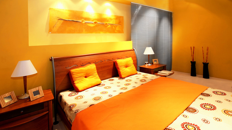 bedroom with orangey yellow walls