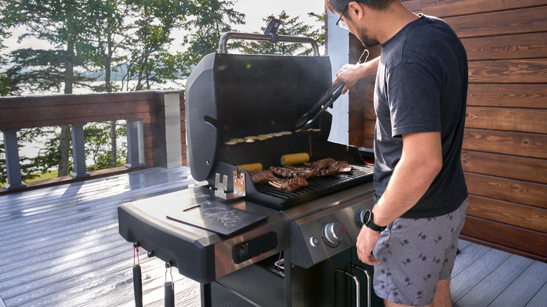 Person grilling meat